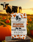 Pumpkin Pastures Beef Tallow bar soap in a field with pumpkins and a cow.