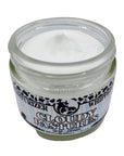 Jar of white cream with a label on a light gray background